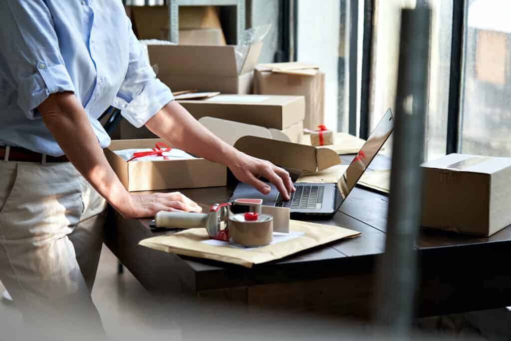 worker logging into customer portal on laptop